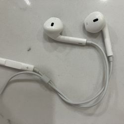 Wired Apple EarPods. remote control on the cable for volume and playback control.