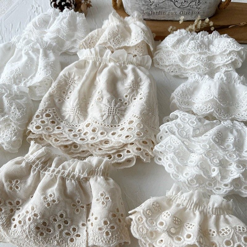 High-end pure cotton embroidered white lace trim. The hem and cuffs of the skirt are made of cotton fabric, handcrafted and wide