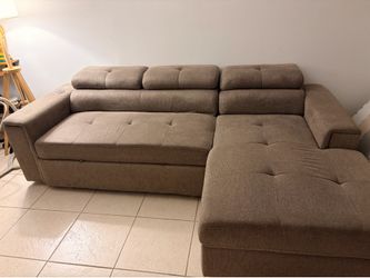 Modern Storage Sleeper Sectional Sofa with Adjustable Headrests from Rooms To Go - PICKUP ONLY