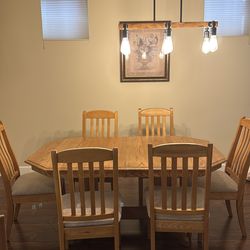 Solid oak table with 8 chairs and leaf