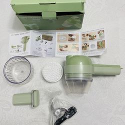 Electric 4-in-one Hand-Held Food processor. Includes functions such as slicing, mincing, peeling, and cleaning brush. New. Still in original packaging