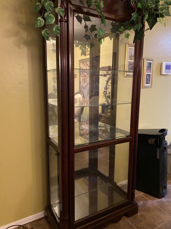 Cherry red curio glass shelves w light for Sale in Peoria, AZ OfferUp