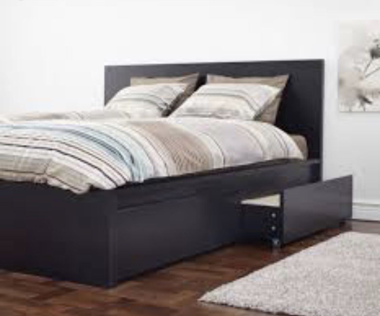 IKEA’s wooden bed with two drawers