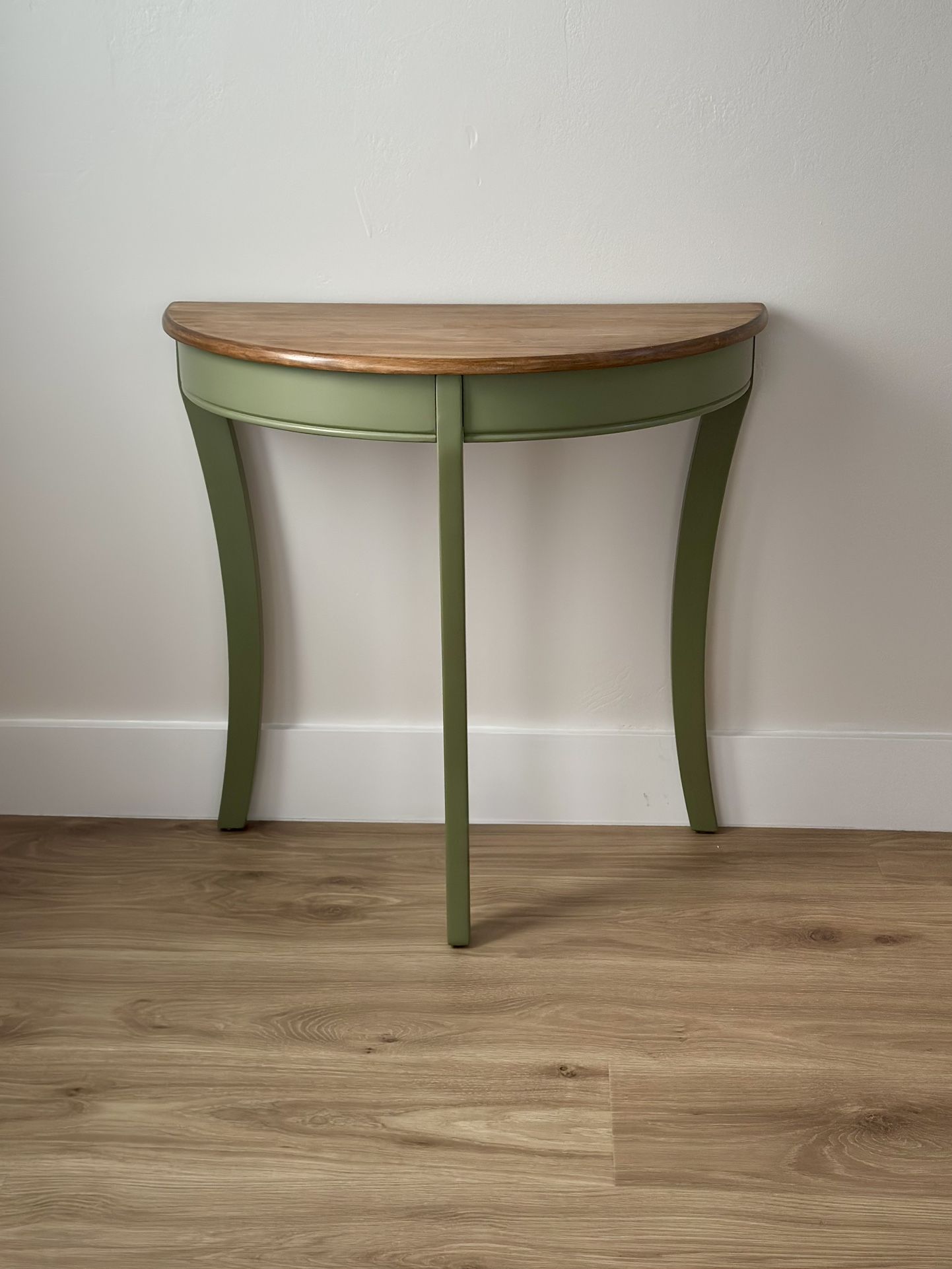 Stylish green half-moon console table