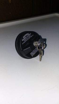 (GENTLY USED) CHEVY LOCKING GAS CAP WITH 2 KEYS. $12 OR BEST OFFER.