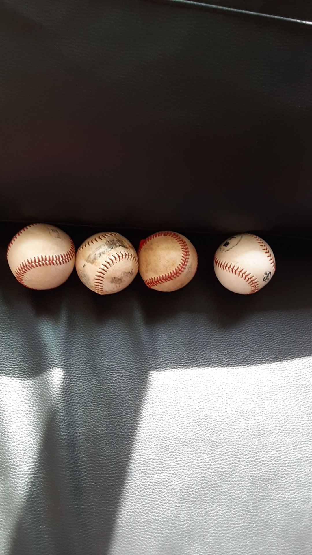4 baseball balls