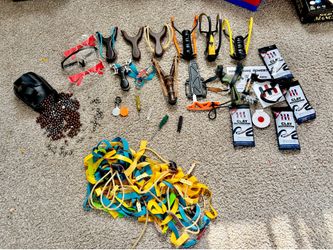 9 Sling shots with steel and clay bullets accessories etc