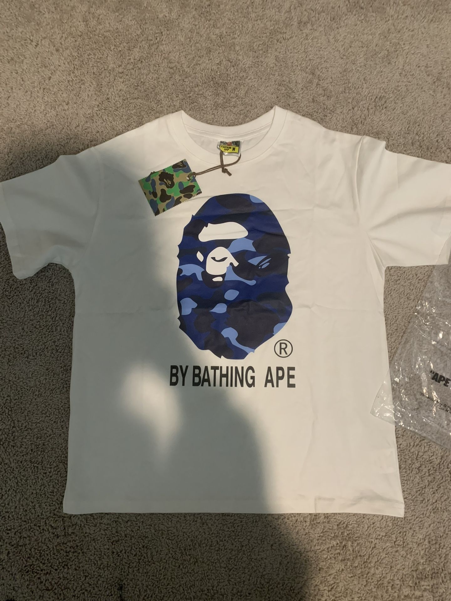 A Bathing Ape (BAPE) Multi-Color Ape Head Tee – Size M – Brand New in Bag Cop this authentic A Bathing Ape T-shirt in size M, featuring the iconic mu