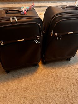 Pair of Chaps suitcases for sale