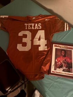 Game worn ricky Williams texas jersey and pick autographed collectable