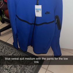 medium blue nike tech suit (with pants)