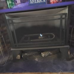 Gas/propane Stove.  Keeps Our entire House So Warm We Never Have To Turn On The Electric Heat