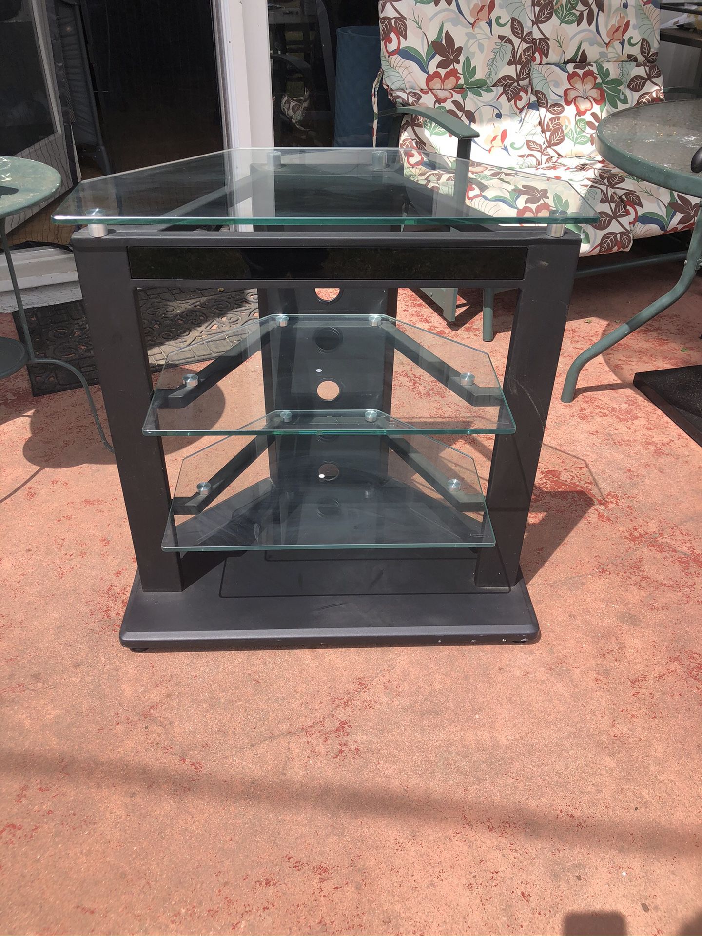 Really nice tv media stand. In excellent condition. Really well made. Sturdy metal frame and heavy glass. Really really nice