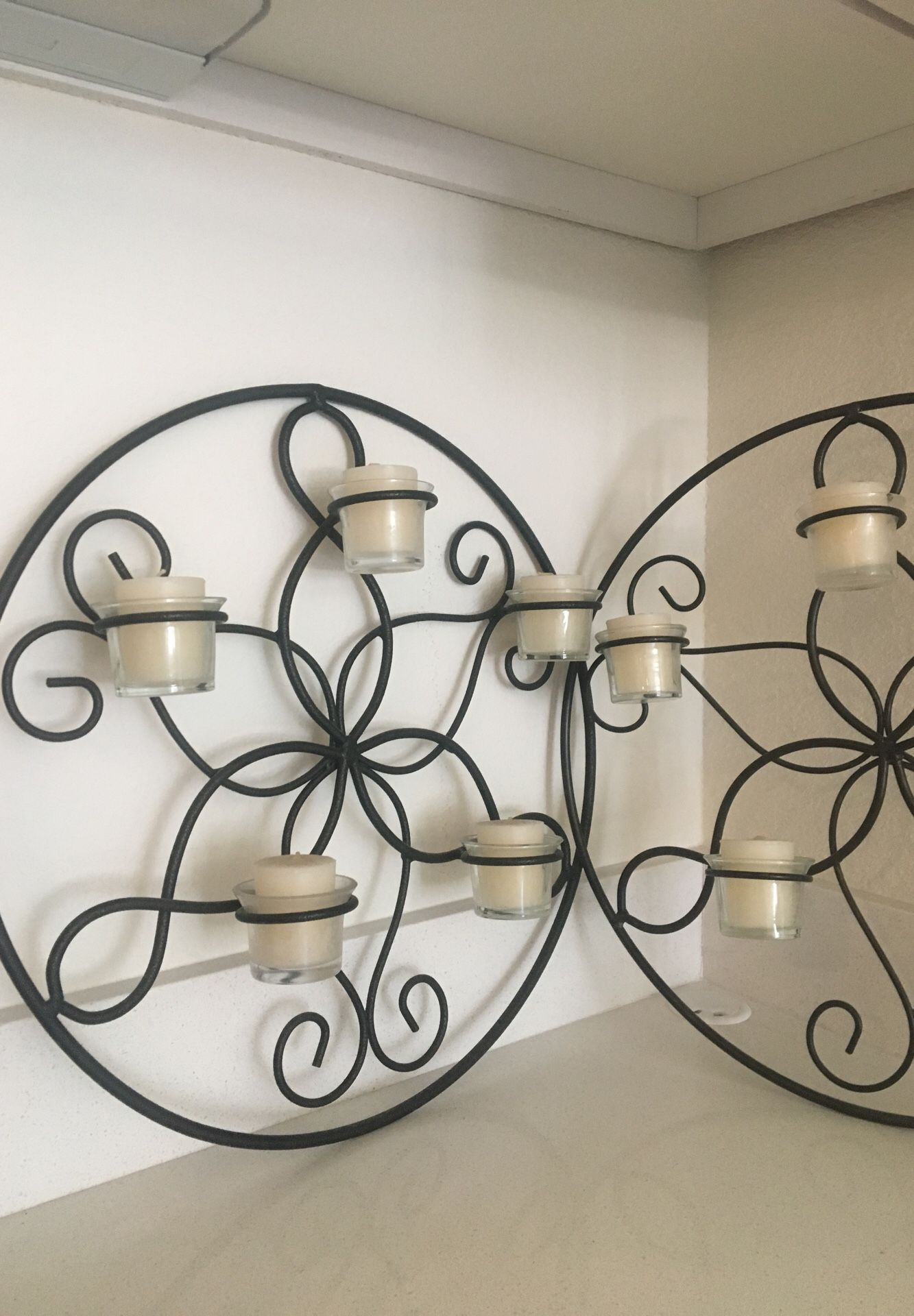 Steel wall decoration with candles