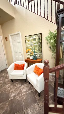 Beautiful set of two white barrel accent chairs in excellent condition