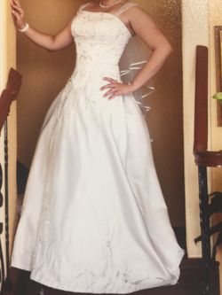 Wedding dress with removable train and pockets.