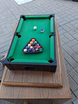 Tae top pool table with stand needs cue sticks but otherwise good to Dario