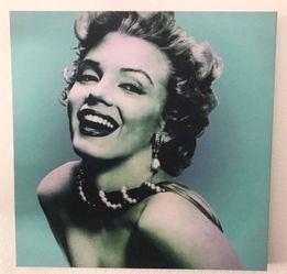 Iconic canvas print of Marilyn Monroe 24 x 24. Has a cool pop art vibe with a teal background. Looks great on any wall. Pickup in the area of 36th Av