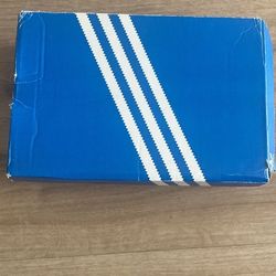 White Adidas Superstars