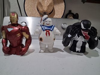 Marvel venom bust coin bank,  Ghostbusters stay puft marshmallow man,   and marvel iron man bust piggy bank.