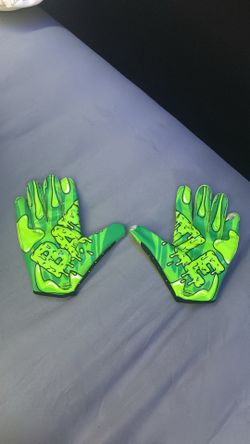 Battle gloves with green slime dripping design