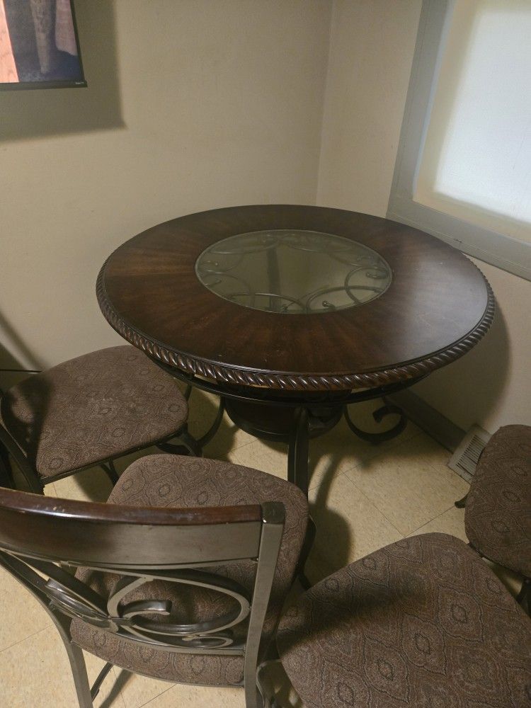 Ashley Furniture Wood And Glass 4 Chairs Included