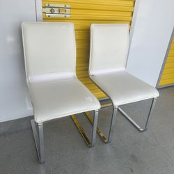 Two White Leather Chairs