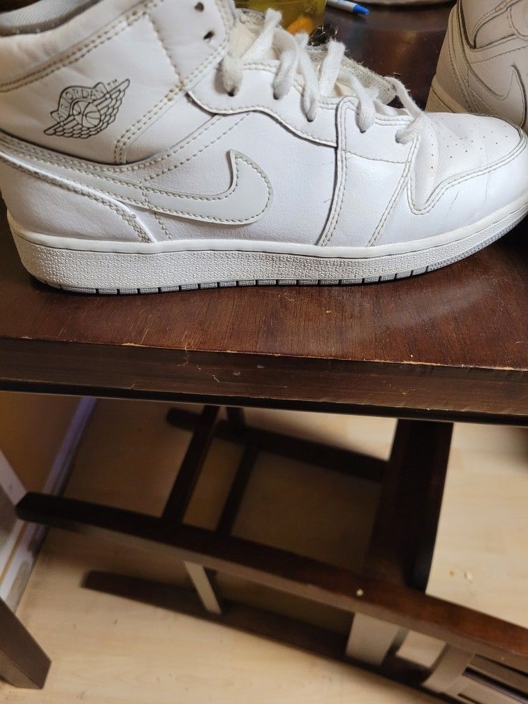 White Nike Air Jordan 1s
