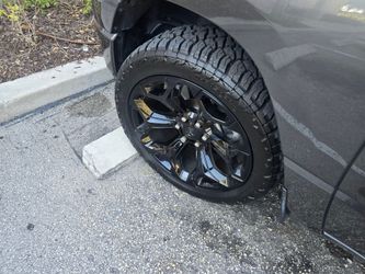 4 Ram Limited 22-inch oem rims with all terrain tires 285/45R22
