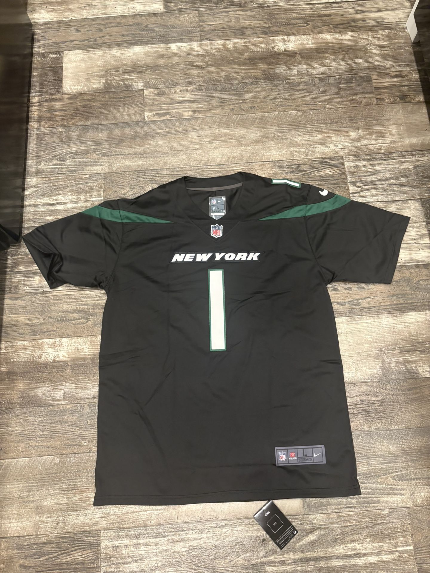 Sauce Gardner (sz Below) black and green New York Jets football jersey