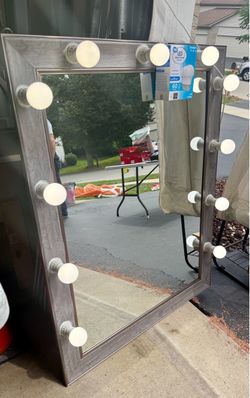 Hollywood style light-up, make-up, fashion mirror. 35 1/2” wide, 45 1/2” tall, takes 11 light bulbs