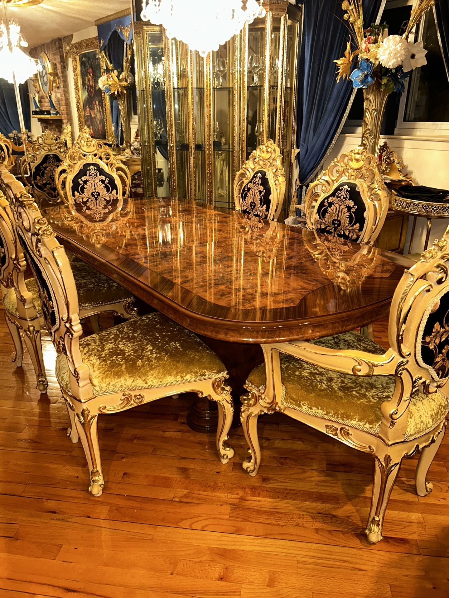 Dining Room Table And Chairs And A Gold And Browns Hutch