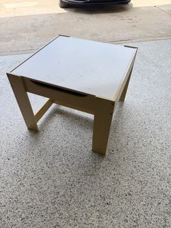 Children play table with storage compartment