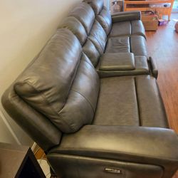Faux leather fully reclining sectional couch