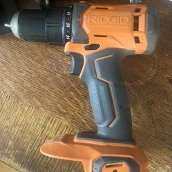 Ridgid Drill, Light Stand, Charger And Battery
