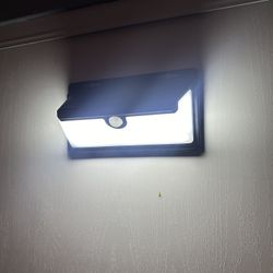 LED lamp with motion sensor and solar panel
