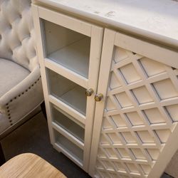 White Cabinet with Decorative Door – $85