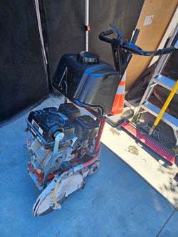 Husqvarna walk behind saw with near new predator engine.