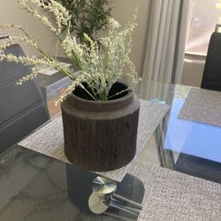 stipped stone vase with flowers / home decor