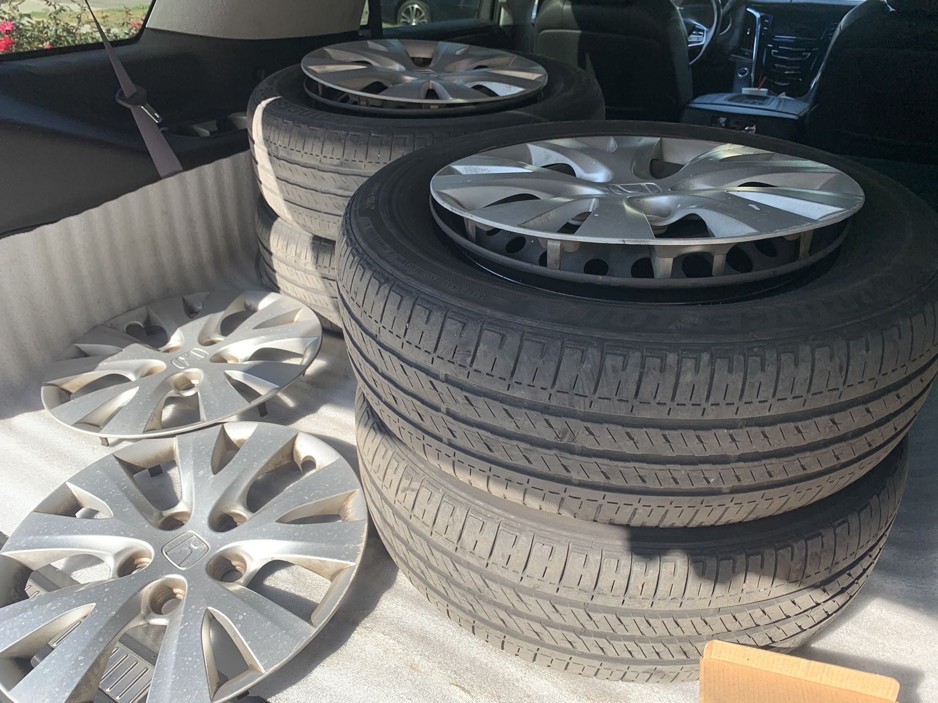 Honda Civic rims and tires (steel wheels with hubcaps ) 15”