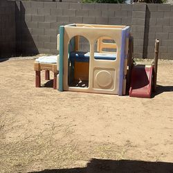 Slide, water table, and children’s fort