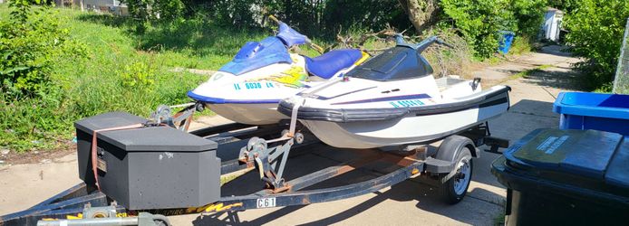 2 jetskis and trailer.