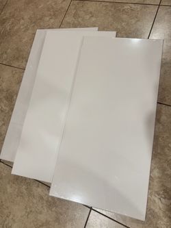 3 canvases, plastic wrapped