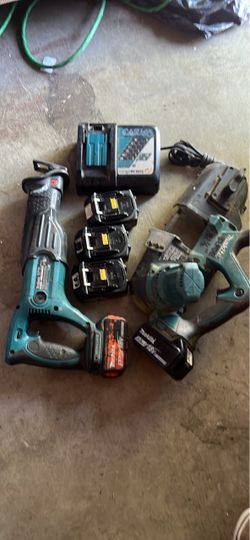 Makita band saw reciprocating saw. Charger and five batteries
