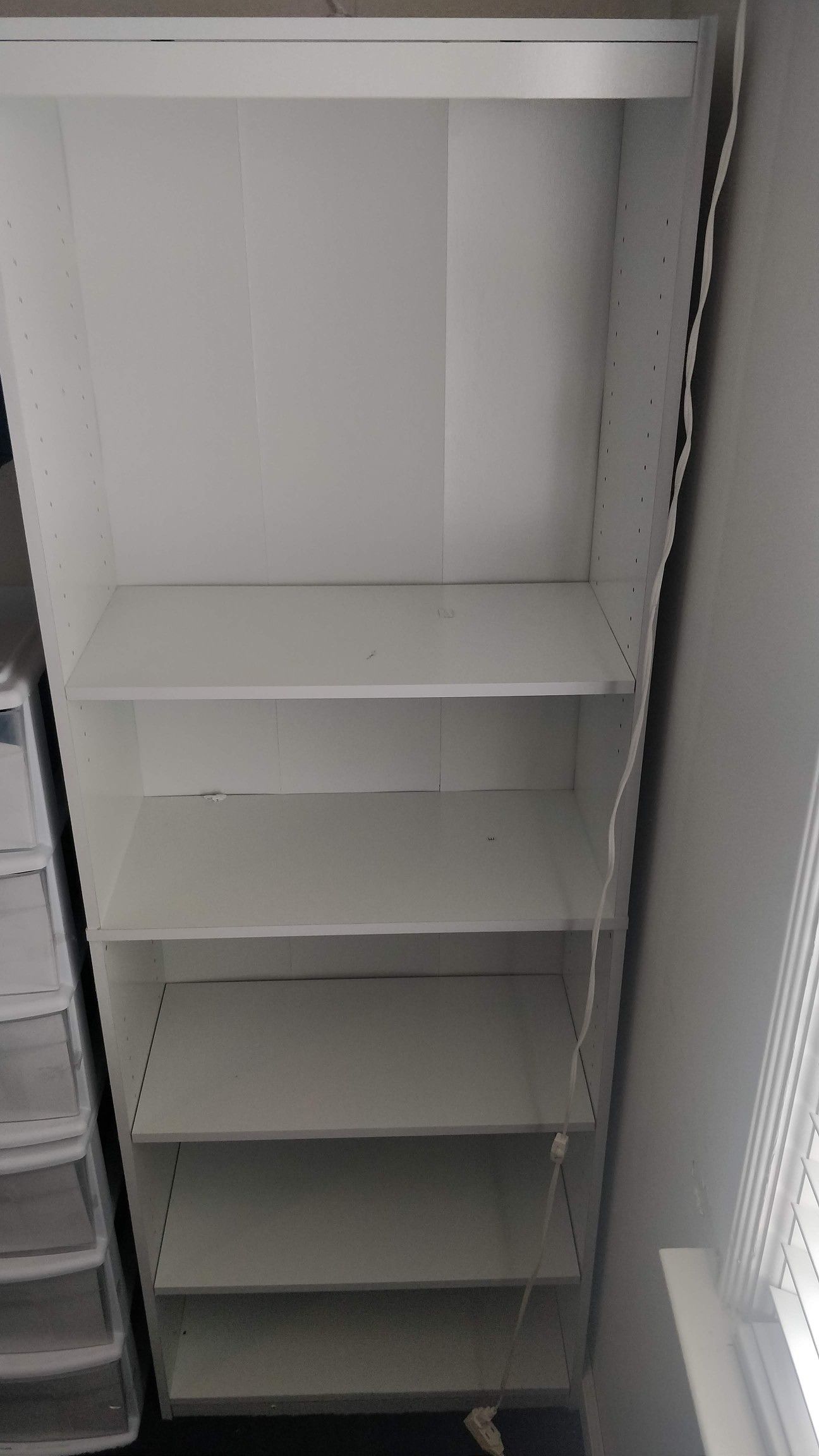 2 large white bookcases