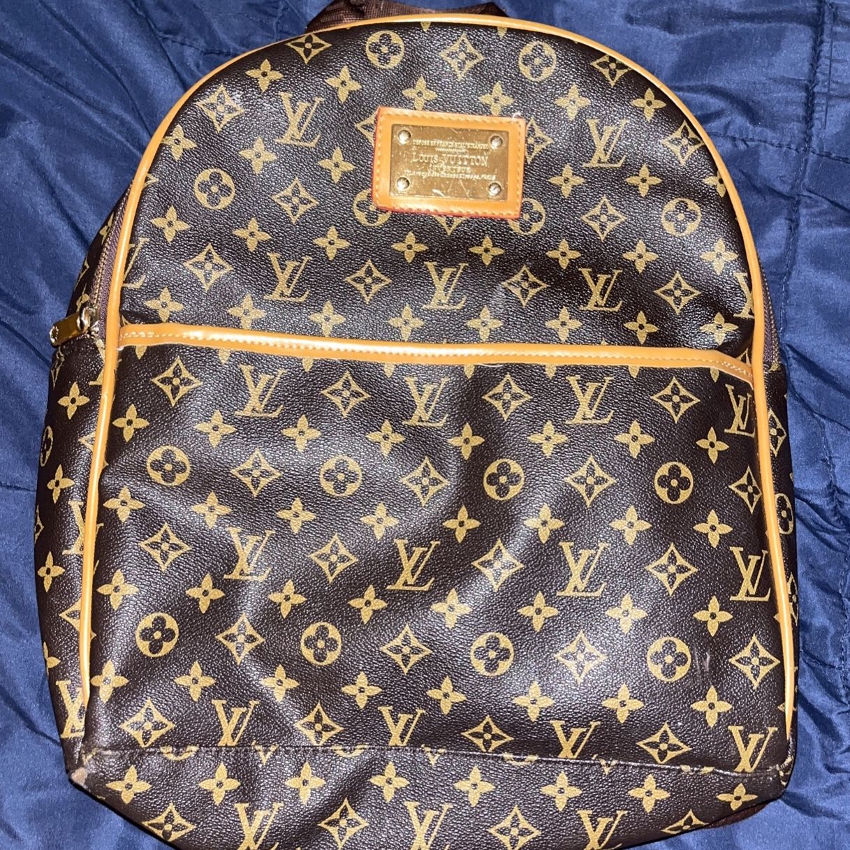 louis vuitton backpack with gold plate Plated Markings on the hardware. LOUIS VUITTON Discovery Backpack PM