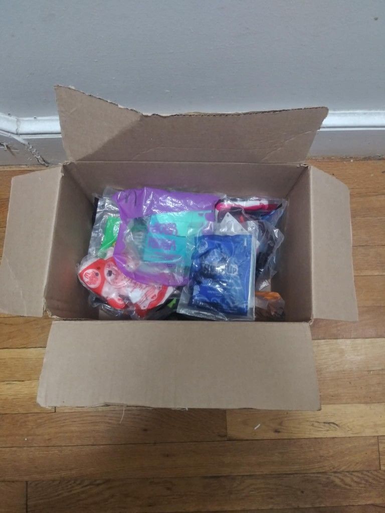 Box Of Random Old Sealed Mcdonald Toys.