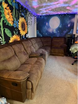 Brown sectional couch with recliners