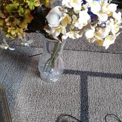 Glass vase, flowers, : clock Is 10