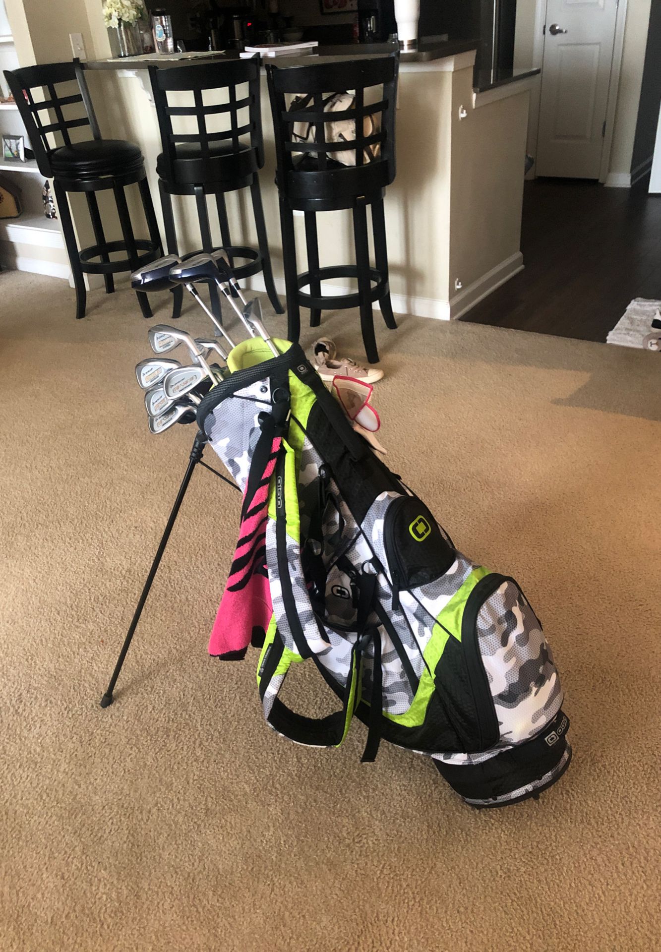 Golf clubs with Ogio bag, towel, ladies glove, golf balls